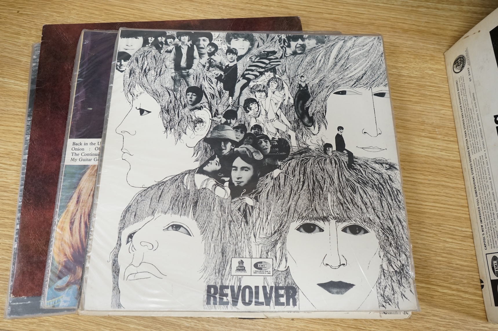 Seven The Beatles LP record albums including; Rubber Soul, two copies of Revolver, The Beatles Vol.1 - Chilean pressing, Love Songs, John Lennon; Rock ‘n’ Roll, Paul McCartney RAM - Chilean pressing.